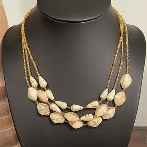 Vintage triple strand gold seed bead and ivory swirl beaded necklace